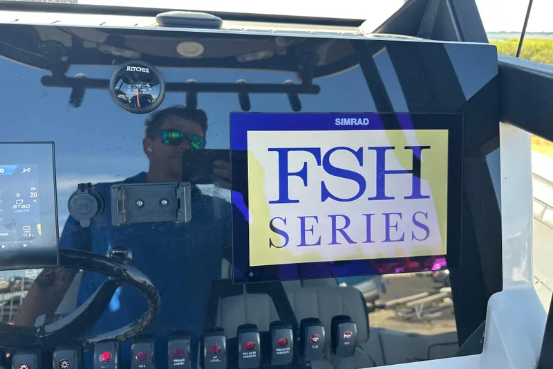 Slide: The Image of 2023 Yamaha Boats 252 FSH Sport dashboard with FSH Series display and controls. - 47