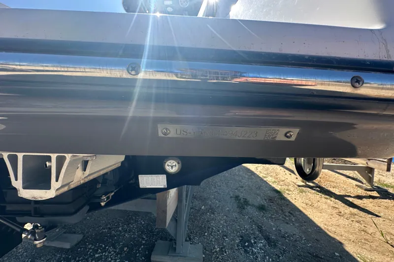 Slide: The Image of 2023 Yamaha Boats 252 FSH Sport hull identification number plate in sunlight. - 9