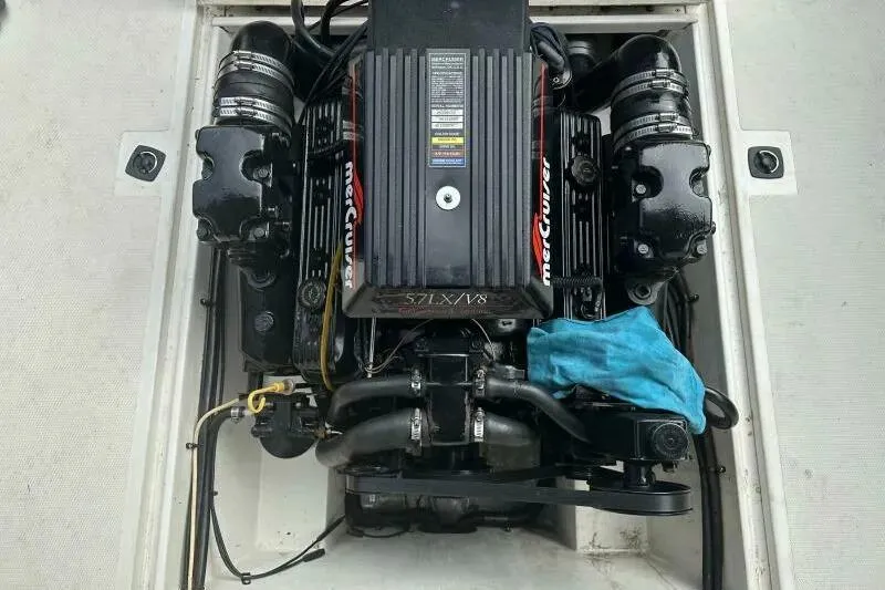 Slide: The Image of 1997 Limestone 24 Cuddy boat engine, featuring a MerCruiser 5.7L V8. - 16