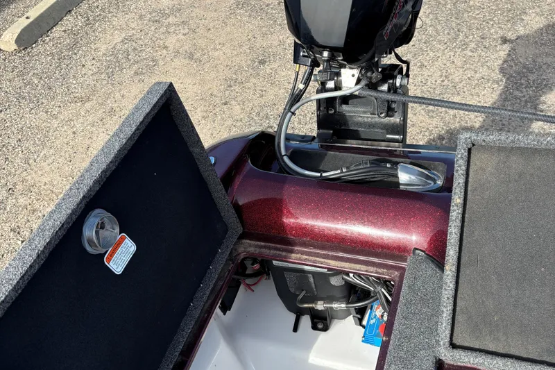 Slide: The Image of 2021 Tracker Nitro ZV21 boat engine compartment with open storage hatch. - 10