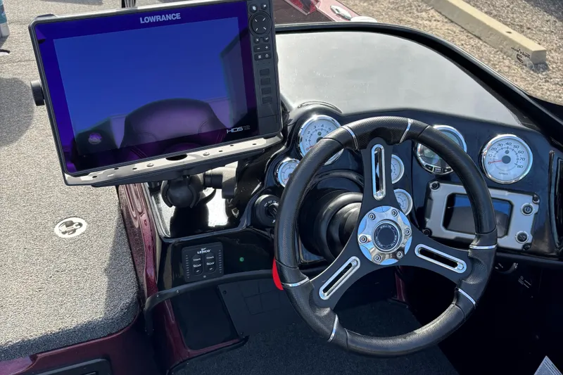Slide: The Image of 2021 Tracker Nitro ZV21 dashboard with Lowrance display and steering wheel. - 21