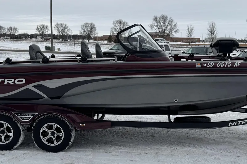 Slide: The Image of 2021 Nitro ZV21 boat on trailer in snowy parking lot. - 27
