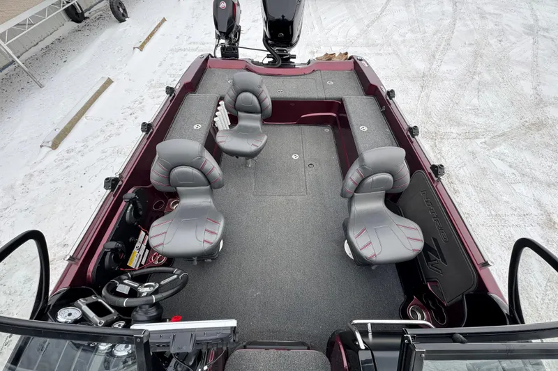 Slide: The Image of 2021 Nitro ZV21 boat interior with four gray seats and steering console. - 29