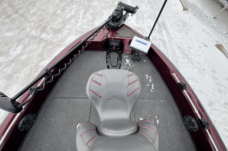 Slide: The Image of 2021 Nitro ZV21 boat interior with gray seat and Lowrance equipment. - 31