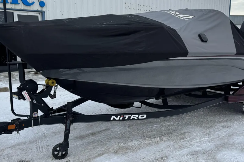 Slide: The Image of 2021 Nitro ZV21 boat on trailer, covered, parked on snowy ground. - 34