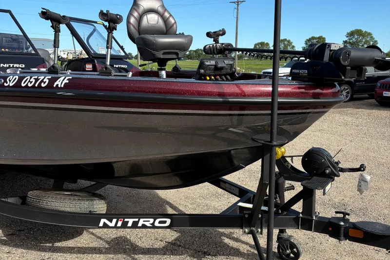 Slide: The Image of 2021 Tracker Nitro ZV21 boat on trailer, featuring Minn Kota trolling motor. - 7