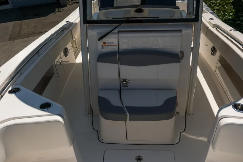 Slide: The Image of 2023 Robalo R302 Center Console boat interior with seating and storage compartments. - 14