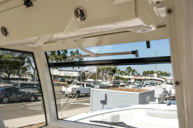 Slide: The Image of 2023 Robalo R302 Center Console boat interior with open window view. - 22