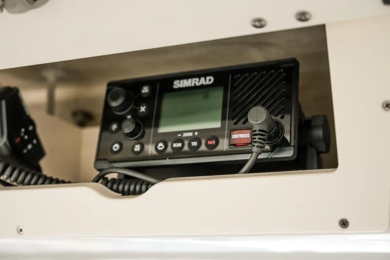 Slide: The Image of Simrad marine radio in 2023 Robalo R302 Center Console boat. - 27