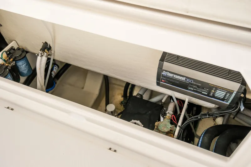 Slide: The Image of 2023 Robalo R302 Center Console boat's electrical and plumbing components. - 31