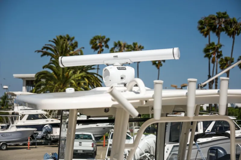 Slide: The Image of 2023 Robalo R302 Center Console radar system with palm trees in background. - 34