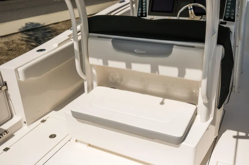 Slide: The Image of 2023 Robalo R302 Center Console boat interior with seating and console view. - 9