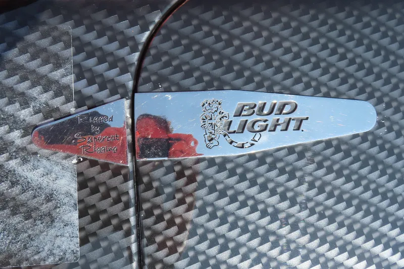 Slide: The Image of Chrome Bud Light logo on carbon fiber surface, MTI 44, 2005 model. - 10