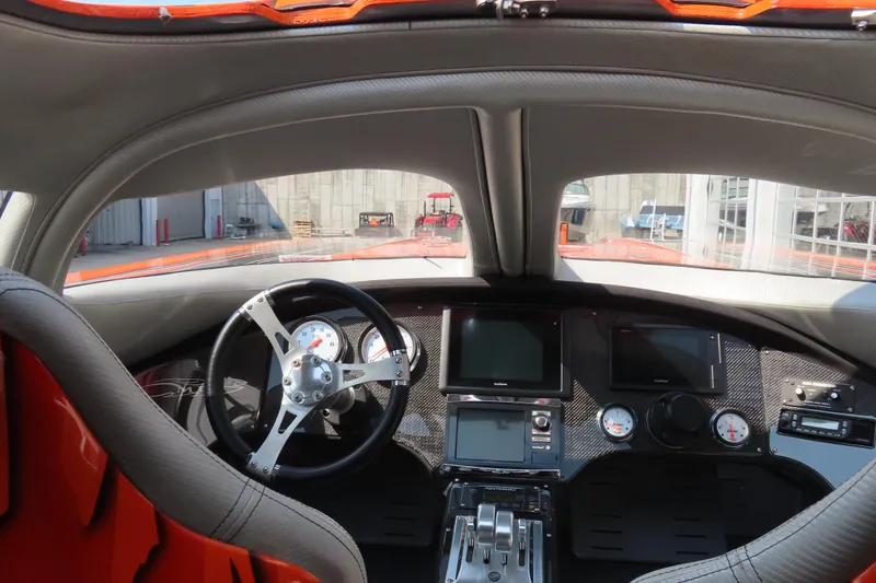 Slide: The Image of Interior of a 2005 MTI 44 boat with modern dashboard and steering wheel. - 11