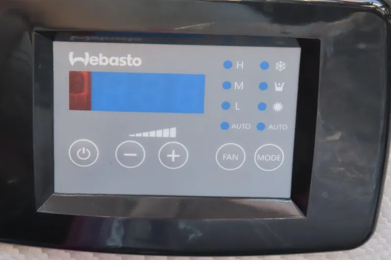 Slide: The Image of Webasto control panel on MTI 44, 2005 model, displaying temperature and fan settings. - 14