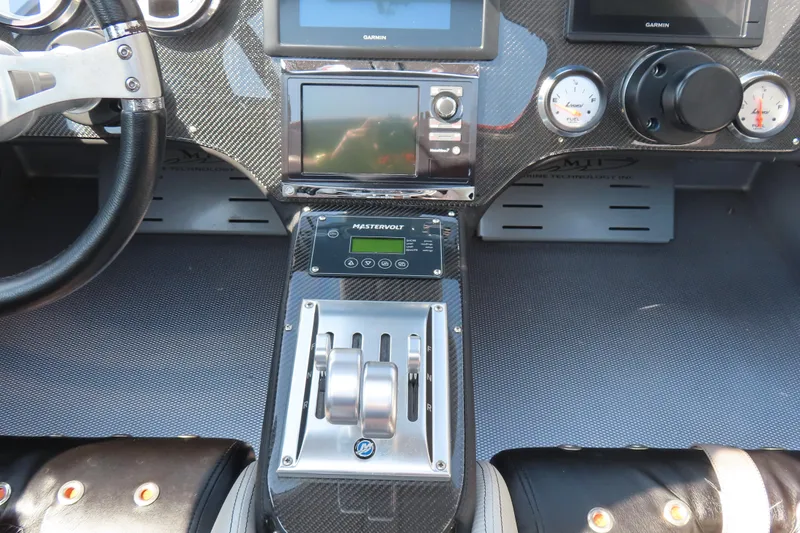 Slide: The Image of Dashboard of a 2005 MTI 44 boat with navigation and control systems. - 15