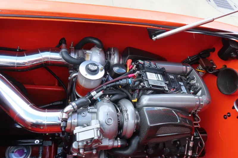 Slide: The Image of High-performance engine of 2005 MTI 44 with polished components and vibrant orange detailing. - 18