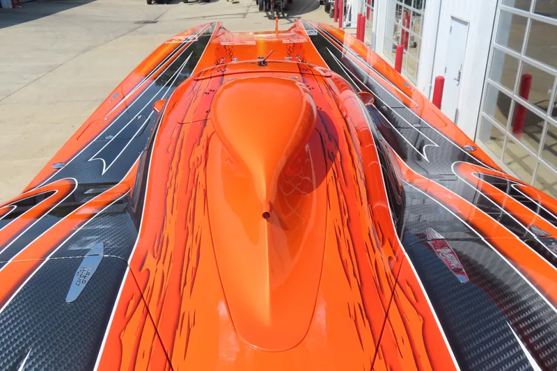 Slide: The Image of Orange and black MTI 44 speedboat, 2005 model, with sleek aerodynamic design. - 9