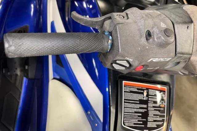 Slide: The Image of Close-up of 2018 Yamaha WaveRunner GP1800 handlebar controls, featuring throttle and grip. - 11