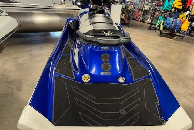 Slide: The Image of 2018 Yamaha WaveRunner GP1800 in showroom, blue and black design, rear view. - 4