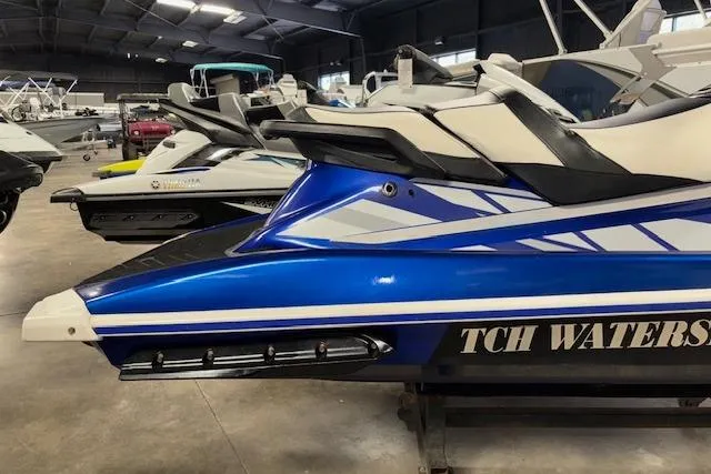 Slide: The Image of 2018 Yamaha WaveRunner GP1800 in showroom, blue and white design, side view. - 6