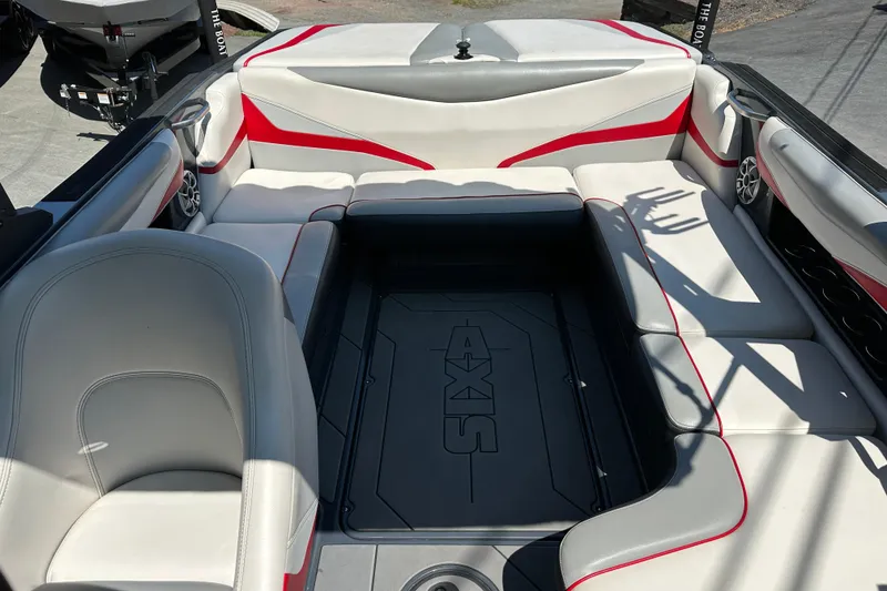 Slide: The Image of 2018 Axis T22 boat interior with white and red seating, featuring a spacious layout. - 16