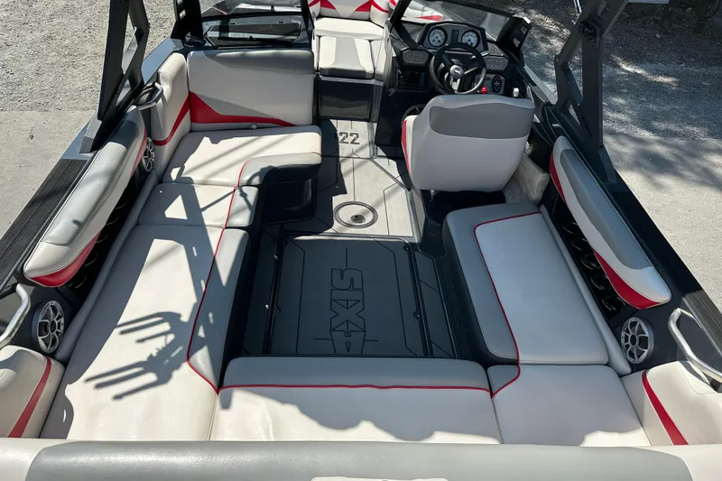 Slide: The Image of 2018 Axis T22 boat interior with spacious seating and modern dashboard design. - 7