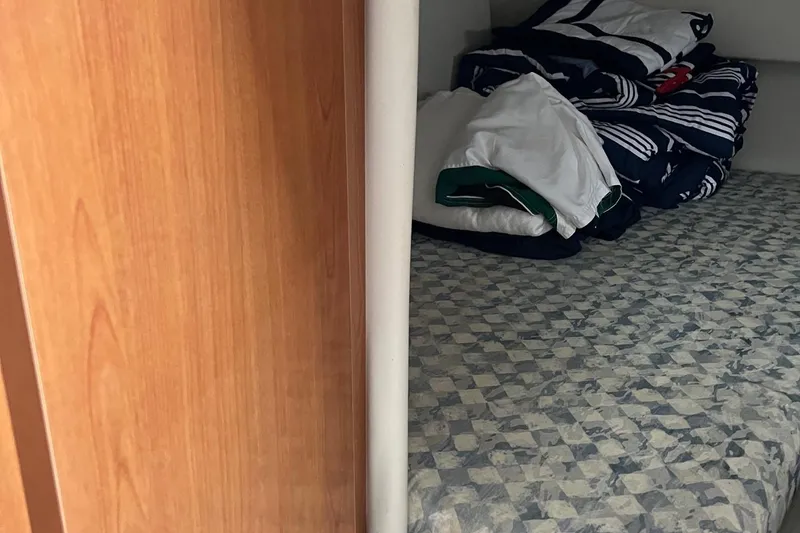 Slide: The Image of Interior cabin of 2002 Four Winns 268 Vista boat with bedding. - 10