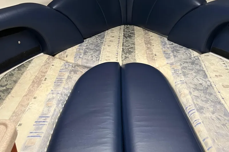 Slide: The Image of 2002 Four Winns 268 Vista interior with blue and patterned upholstery. - 15