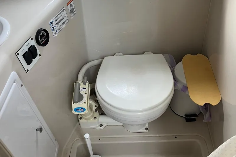 Slide: The Image of 2002 Four Winns 268 Vista boat bathroom with Jabsco marine toilet. - 17