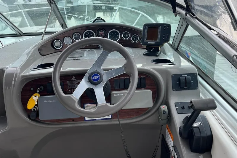 Slide: The Image of Steering console of 2002 Four Winns 268 Vista boat with gauges and controls. - 7