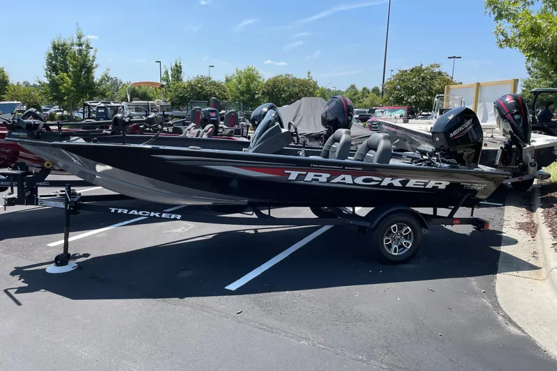 Slide: The Image of 2026 Tracker Pro Team 175 Tournament Edition boat on trailer in parking lot. - 1
