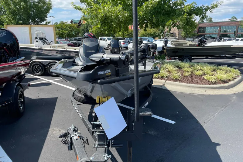 Slide: The Image of 2026 Tracker Pro Team 175 Tournament Edition boat in parking lot, featuring Minn Kota motor. - 2