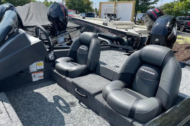Slide: The Image of 2026 Tracker Pro Team 175 Tournament Edition boat interior with plush seating and steering wheel. - 4