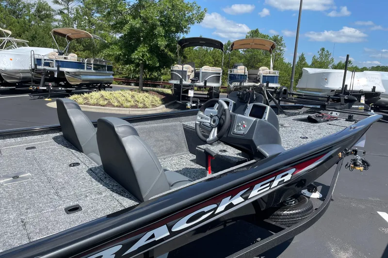 Slide: The Image of 2026 Tracker Pro Team 175 Tournament Edition boat in a sunny outdoor showroom. - 5