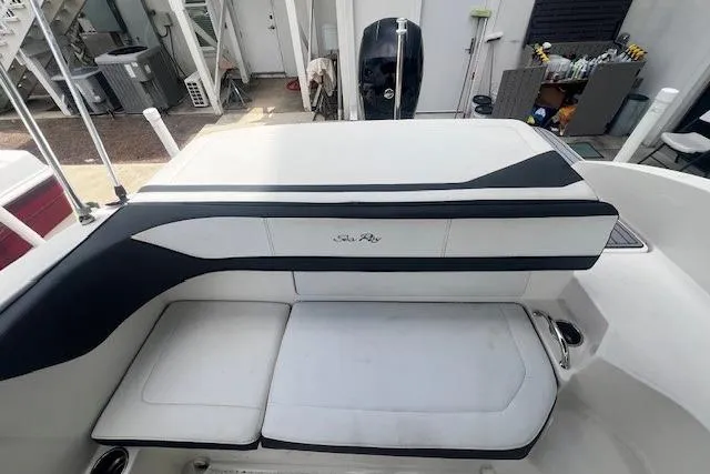 Slide: The Image of 2018 Sea Ray 19 SPX OB boat seating area with white and black upholstery. - 14