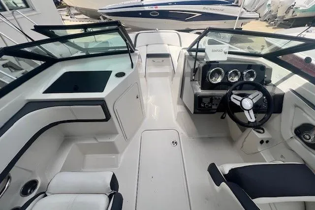 Slide: The Image of 2018 Sea Ray 19 SPX OB boat interior with steering wheel and seating. - 15