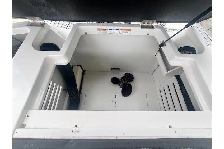Slide: The Image of 2018 Sea Ray 19 SPX OB engine compartment with propeller, open hatch view. - 5