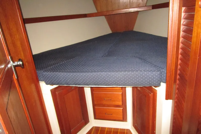 Slide: The Image of V-berth cabin interior of 1989 Catalina 36 sailboat with blue polka dot mattress. - 20