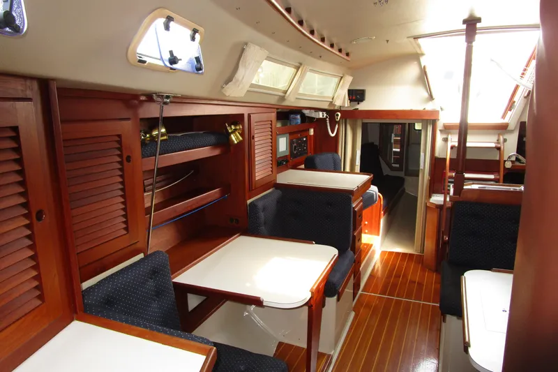 Slide: The Image of Interior of 1989 Catalina 36 sailboat with wooden cabinetry and seating. - 24