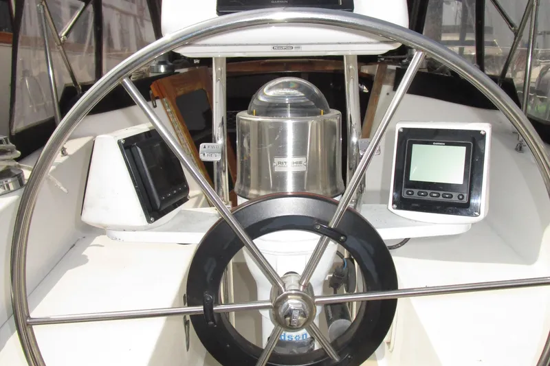 Slide: The Image of Steering wheel and navigation instruments on a 1989 Catalina 36 sailboat. - 3