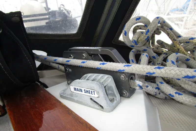 Slide: The Image of Main sheet control on 1989 Catalina 36 sailboat, featuring ropes and pulley system. - 32