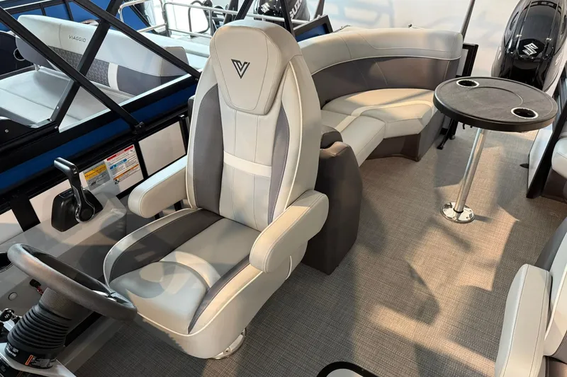 Slide: The Image of 2026 Viaggio Lago X-U boat interior with plush seating and modern steering console. - 10