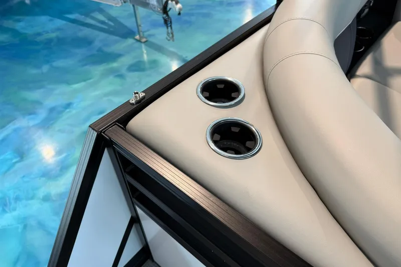 Slide: The Image of Viaggio Lago X-U 2026 boat interior with beige seating and cup holders. - 14