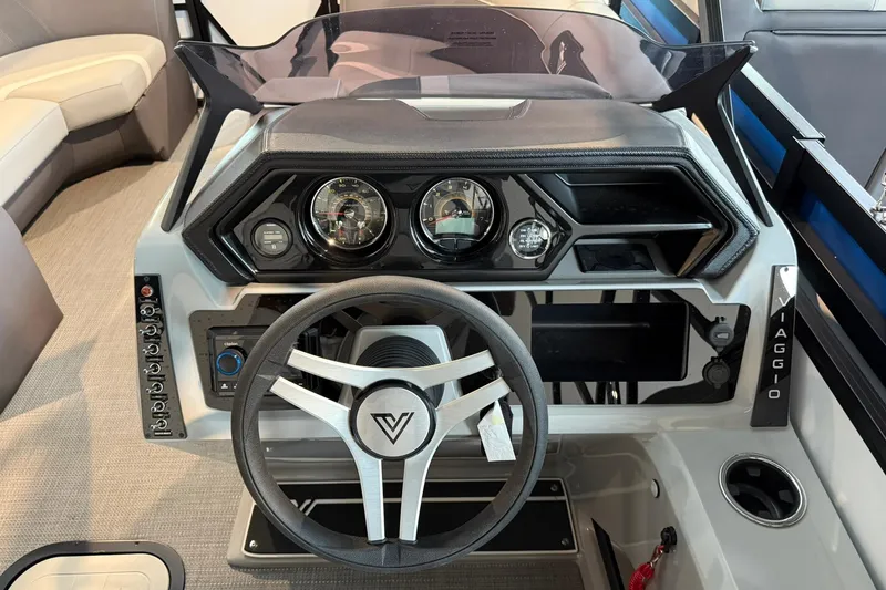 Slide: The Image of 2026 Viaggio Lago X-U boat dashboard with steering wheel and control panel. - 7