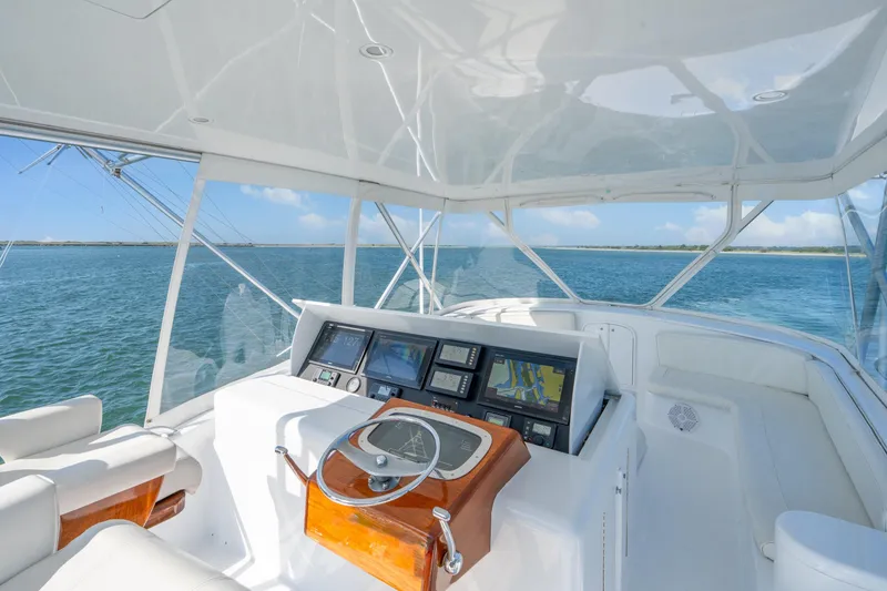 Slide: The Image of Helm of 2004 Sculley Custom Carolina 58' Sportfish with navigation equipment, overlooking ocean. - 11