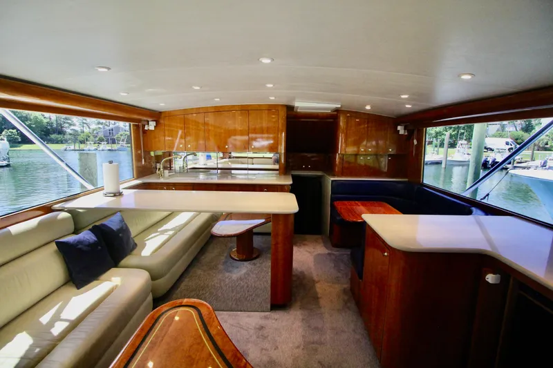Slide: The Image of Luxurious interior of a 2004 Sculley Custom Carolina 58' Sportfish yacht with elegant wood finishes. - 24