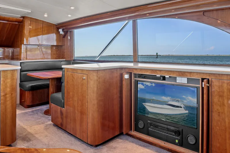 Slide: The Image of Luxurious interior of 2004 Sculley Custom Carolina 58' Sportfish yacht with wood finish and ocean view. - 28