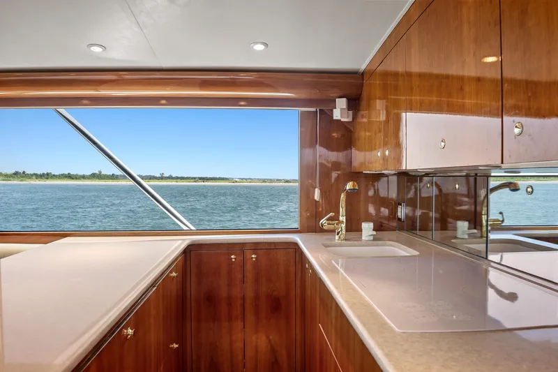 Slide: The Image of Luxurious kitchen interior of 2004 Sculley Custom Carolina 58' Sportfish yacht with ocean view. - 31