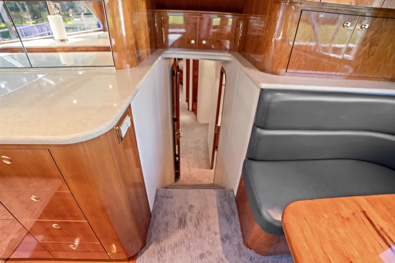 Slide: The Image of Interior of 2004 Sculley Custom Carolina 58' Sportfish with wood cabinetry and seating. - 36